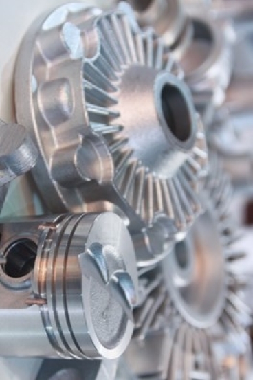 metal casting of several silver gears - precision metal parts manufacturer
