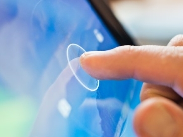 A person touching a touch screen
