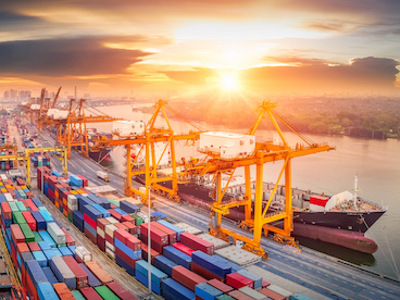 shipping port with containers illustrating transportation of parts and goods via maritime channels