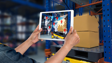 a person holding a tablet with a world map illustrating global multi sourcing