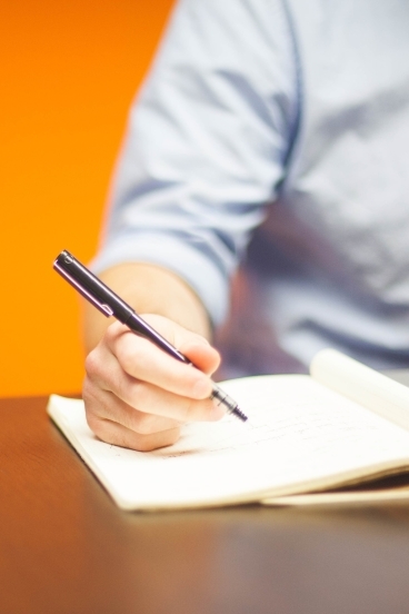 a person taking notes