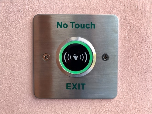 Touchless user interfaces (TUI) Contactless control door unlocking button on the wall