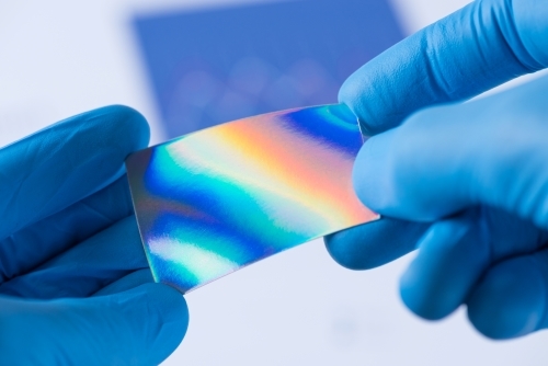 Piece of new type of material with improved properties in laboratory in scientist hands