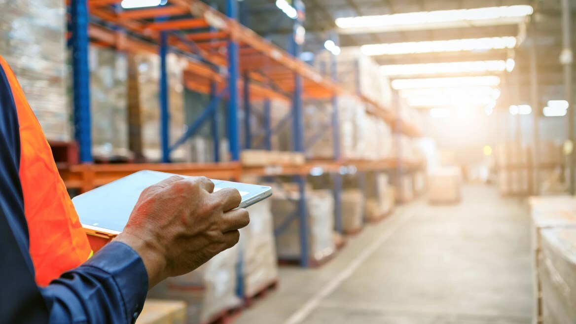 man in a warehouse managing inventory or outsourcing for assurance of supply