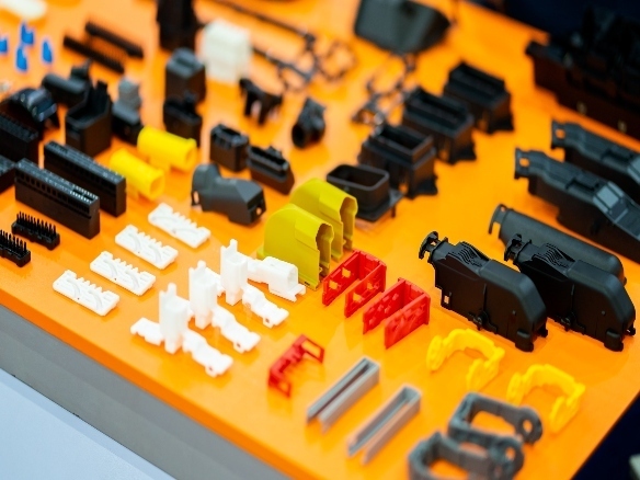 multiple injection molded plastic parts on display